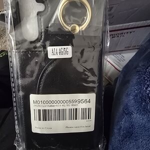 Elegant Black Phone Case with Gold Ring